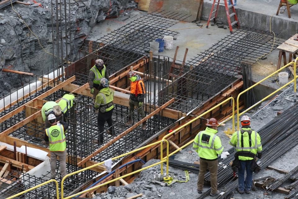 Workers on the construction site of the new performing arts center at Brown University.