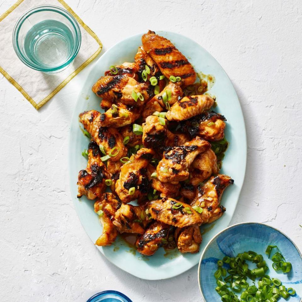 <p>These chicken wings hit every note: sweet, saucy, smoky, and just a little spicy.</p><p><em><a href="https://www.goodhousekeeping.com/food-recipes/a31914016/grilled-chicken-wings-recipe/" rel="nofollow noopener" target="_blank" data-ylk="slk:Get the recipe for Air Fryer Apricot Whiskey Chicken Wings »;elm:context_link;itc:0;sec:content-canvas" class="link ">Get the recipe for Air Fryer Apricot Whiskey Chicken Wings »</a></em> </p>