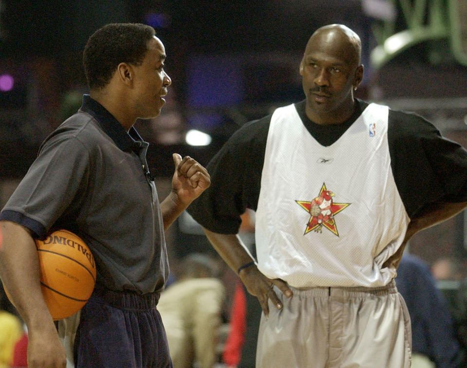 NBA Eastern Conference All Star coach Isiah Thomas talks with Washington Wizards' Michael Jordan during practice for the 2003 NBA All Star Game in Atlanta Saturday, Feb. 8, 2003. (AP Photo/John Bazemore)