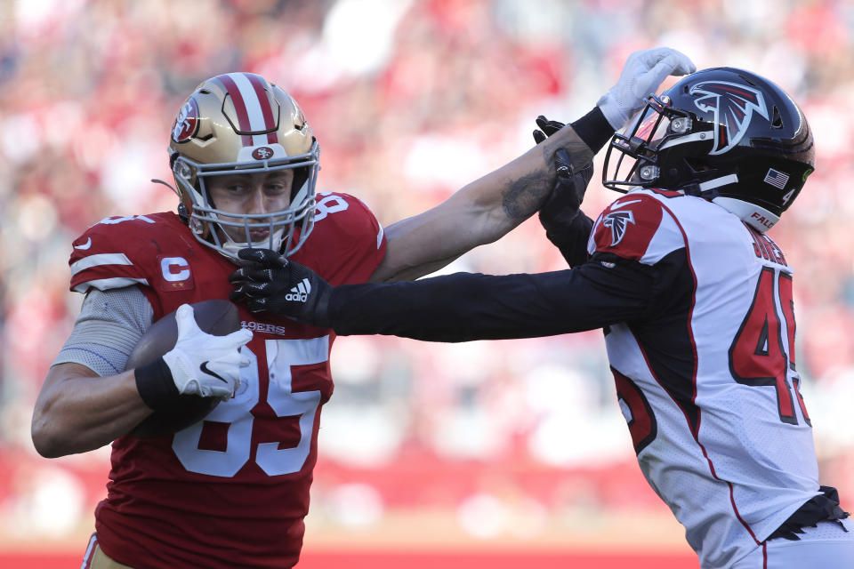 San Francisco 49ers tight end George Kittle (85) stiff arms Atlanta Falcons linebacker Deion Jones during the first half of an NFL football game in Santa Clara, Calif., Sunday, Dec. 15, 2019. (AP Photo/Josie Lepe)