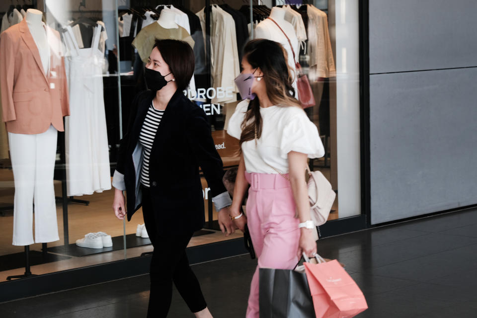 NEW YORK, NEW YORK - MAY 13: People wear face masks inside of a shopping mall in Manhattan on May 13, 2021 in New York City. The CDC announced that people who are fully vaccinated against Covid-19 do not need to wear masks or practice social distancing indoors or outdoors any longer with the exception of exception of special circumstances. (Photo by Spencer Platt/Getty Images)