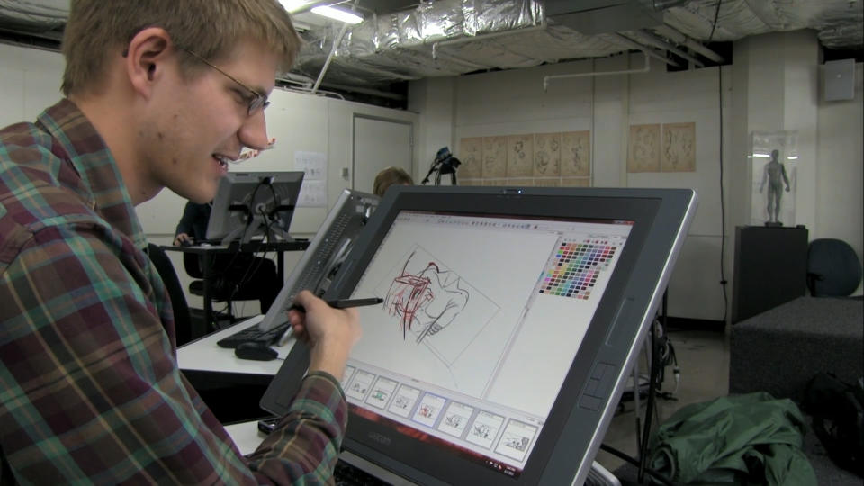 This photo provided by 2K Games shows a student drawing an illustration in the film, "The Art of the Game." 2K Games commissioned filmmaker Matthew Davis Walker and his production company Story Developing to create the feature-length documentary, set to debut for free Thursday, May 8, 2014, on Machinima's Twitch.tv channel and later on Xbox Live and YouTube. The film chronicles budding game designers at the Academy of Art University in San Francisco who competed last year for an internship at 2K by creating short computer-generated films set in the fictional realm from the "Borderlands" games. (AP Photo/2K Games)