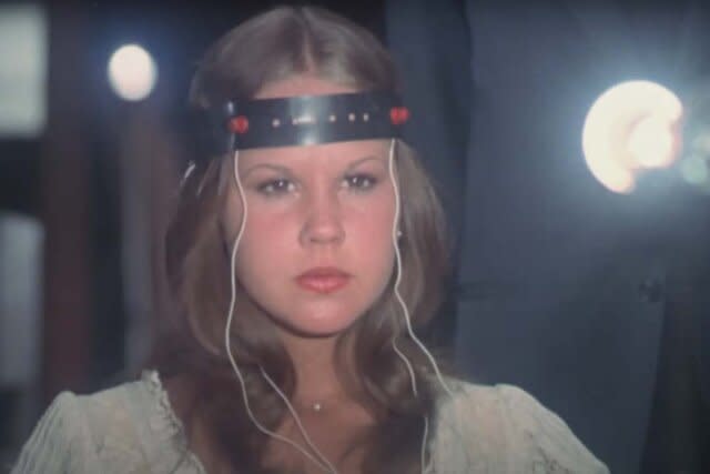 Regan MacNeil (Linda Blair) concentrates while wearing a brain wave monitor in Exorcist II: The Heretic (1977).