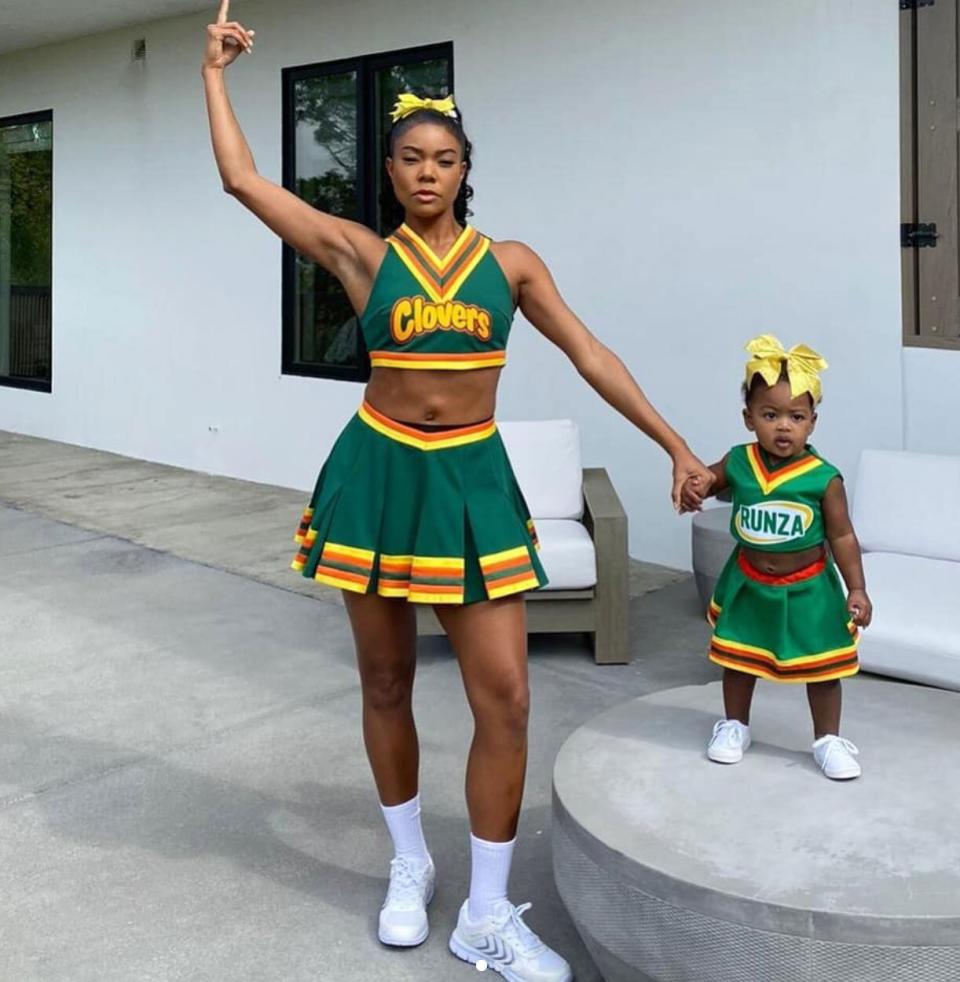 Union-Wade also had a matching throwback moment with her daughter, who dressed in a Clover's uniform (a nod to <em>Bring It On</em>, a film her mom starred in 20 years ago). 