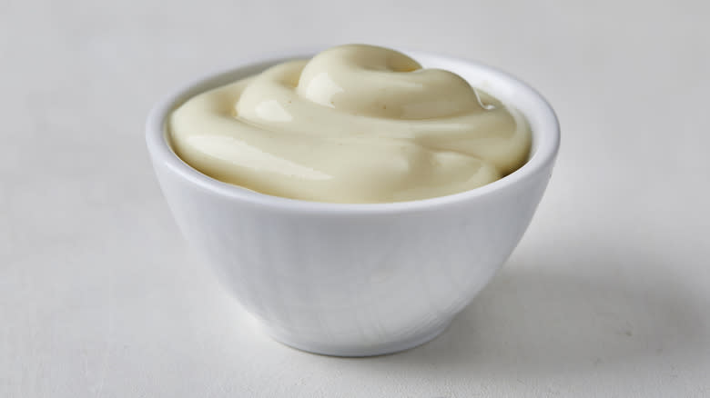 Small white bowl with mayo inside