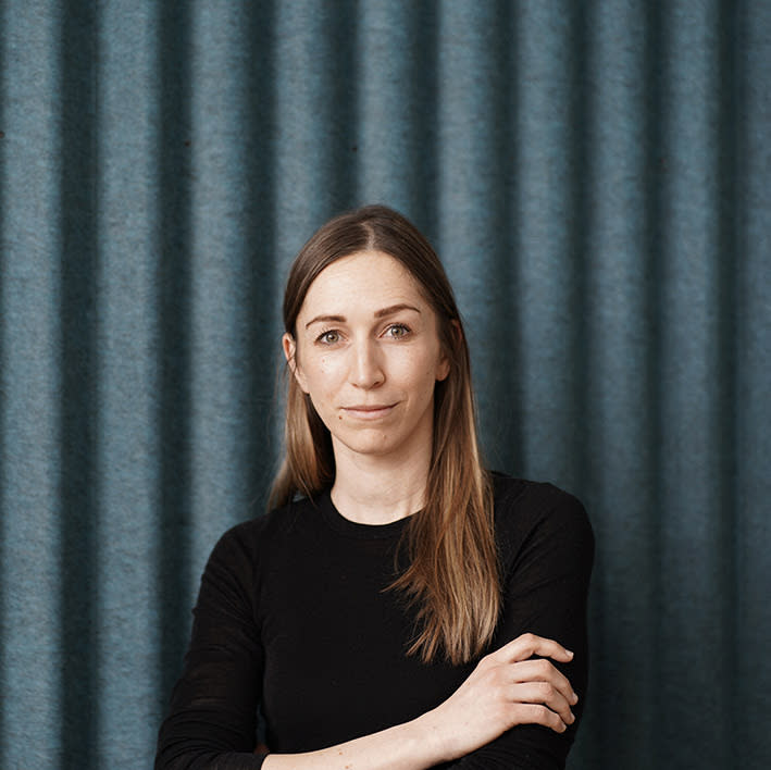 Headshot of Jocelyne Bückner  with arms folded.