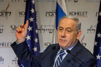 Israeli Prime Minister Benjamin Netanyahu speaks at the Kohelet Policy Forum conference in Jerusalem in 2020. <a href="https://www.gettyimages.com/detail/news-photo/isreali-prime-minister-benjamin-netanyahu-speaks-at-the-news-photo/1192534346?adppopup=true" rel="nofollow noopener" target="_blank" data-ylk="slk:Menahem Kahana/AFP via Getty Images;elm:context_link;itc:0;sec:content-canvas" class="link ">Menahem Kahana/AFP via Getty Images</a>