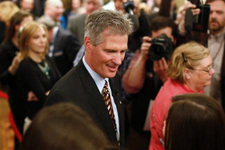 Republican Scott Brown greets supporters after announcing his bid for the United States Senate primary election in Portsmouth, New Hampshire, April 10, 2014. REUTERS/Dominick Reuter