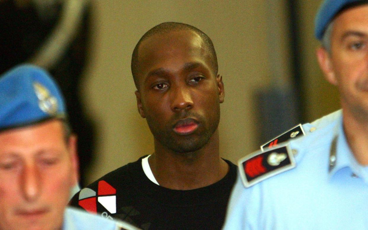 Rudy Guede leaving a court hearing in Perugia in 2008