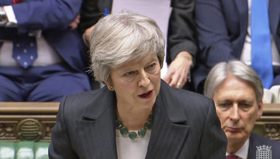 In this grab taken from video, Britain's Prime Minister Theresa May makes a statement on the draft Brexit withdrawal agreement, in the House of Commons in London, Thursday Nov. 15, 2018. Two British Cabinet ministers, including Brexit Secretary Dominic Raab, resigned Thursday in opposition to the divorce deal struck by Prime Minister Theresa May with the EU — a major blow to her authority and her ability to get the deal through Parliament. (PA via AP)