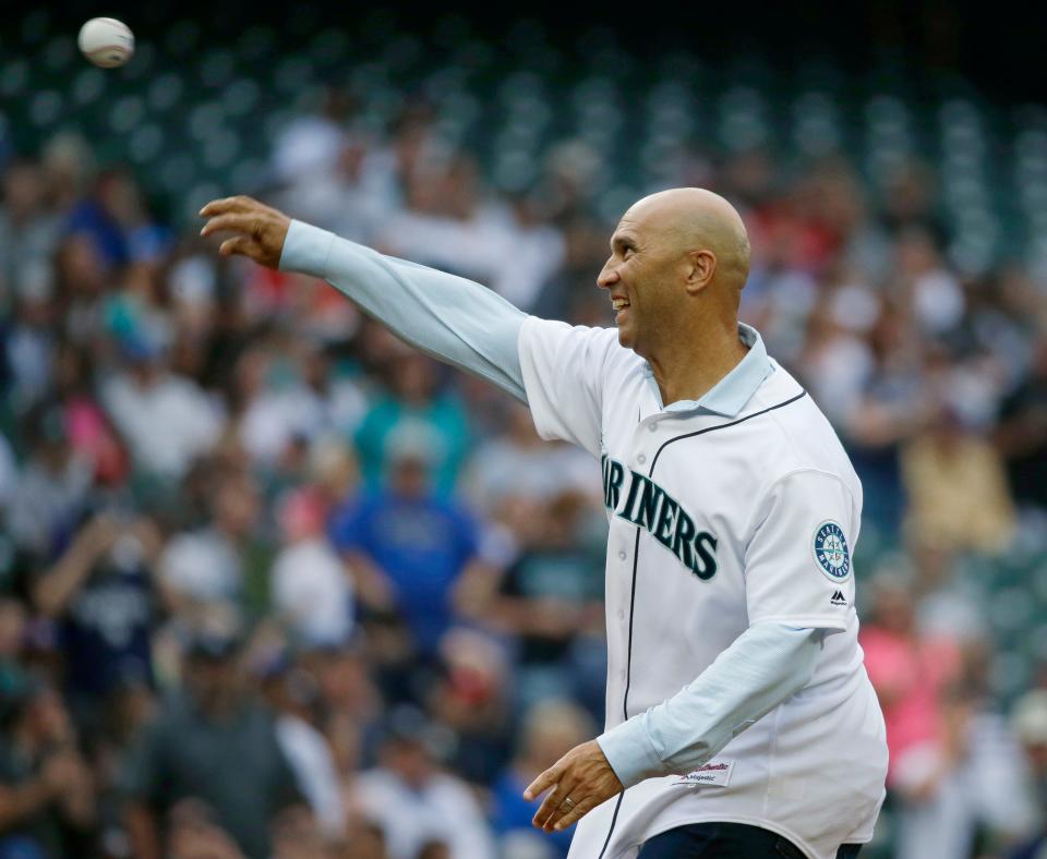 Former Seattle Mariners and New York Yankees outfielder Raul Ibanez throws out the first pitch before the Mariners' baseball game against the Yankees, Friday, July 21, 2017, in Seattle.
