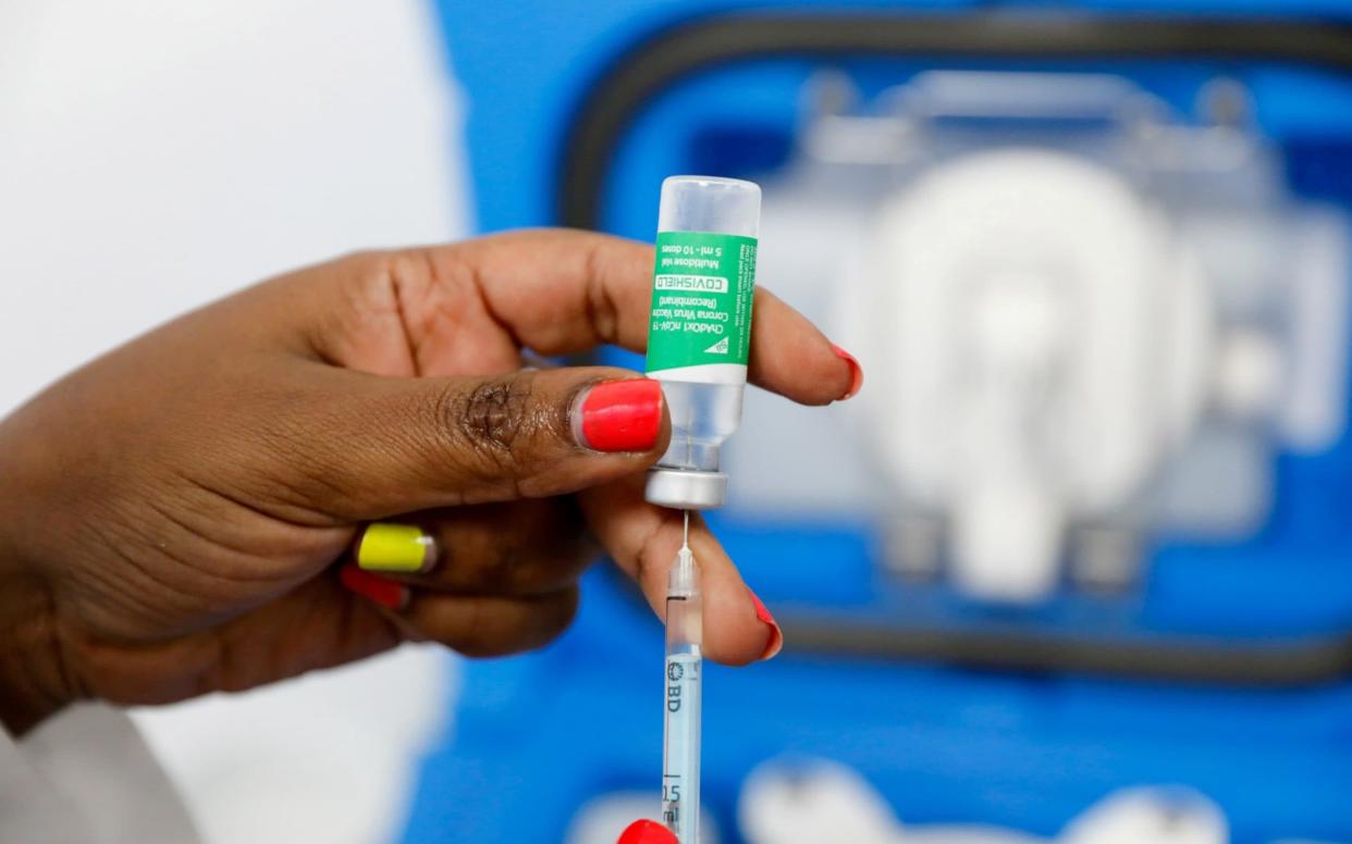 A medical worker prepares a dose of the AstraZeneca/Oxford University jab - Baz Ratner/Reuters