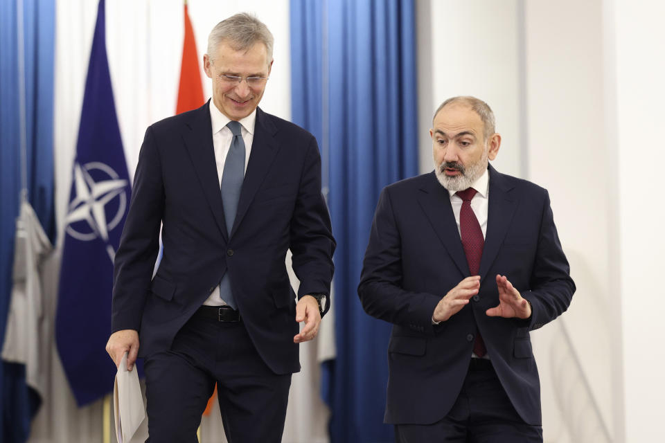 Armenia's Prime Minister Nikol Pashinyan, right, and NATO Secretary General Jens Stoltenberg walk to make joint statements after their meeting in Yerevan, Armenia, Tuesday, March 19, 2024. (Stepan Poghosyan/Photolure via AP)
