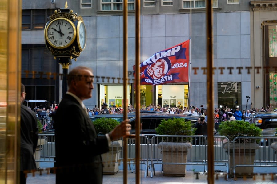 A crowd gathers across the street from Trump Tower, Friday, May 31, 2024, in New York. A day after a New York jury found Donald Trump guilty of 34 felony charges, the presumptive Republican presidential nominee will address the conviction and likely attempt to cast his campaign in a new light. (AP Photo/Julia Nikhinson)