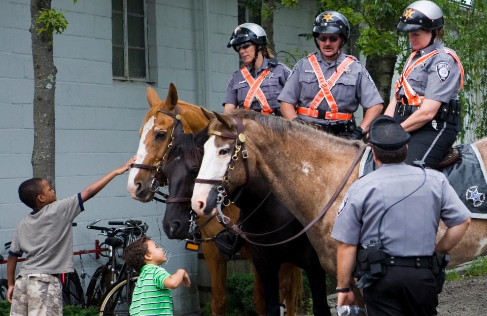 Mounted police officers, pictured here on July 4, 2006, take to the streets of Provincetown after the previous year's Fourth of July rowdiness. Approximately 2,000 people had gathered into a space of just a few blocks around Town Hall.