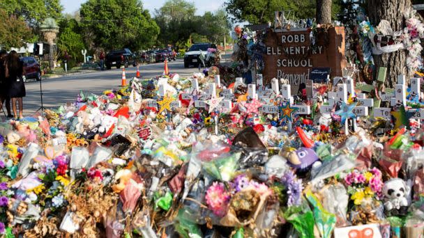 PHOTO:  Weathered signs, candles and stuffed animals remain at a memorial outside Robb Elementary School the day after the video showing the May shooting inside the school released, in Uvalde, Texas, U.S., July 13, 2022.  (Kaylee Greenlee Beal/Reuters, FILE)