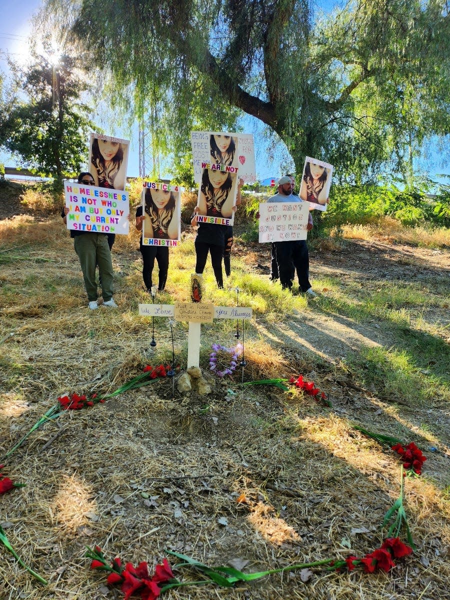 Family members display protest signs at the site of Christine Chavez's death in Modesto, California.