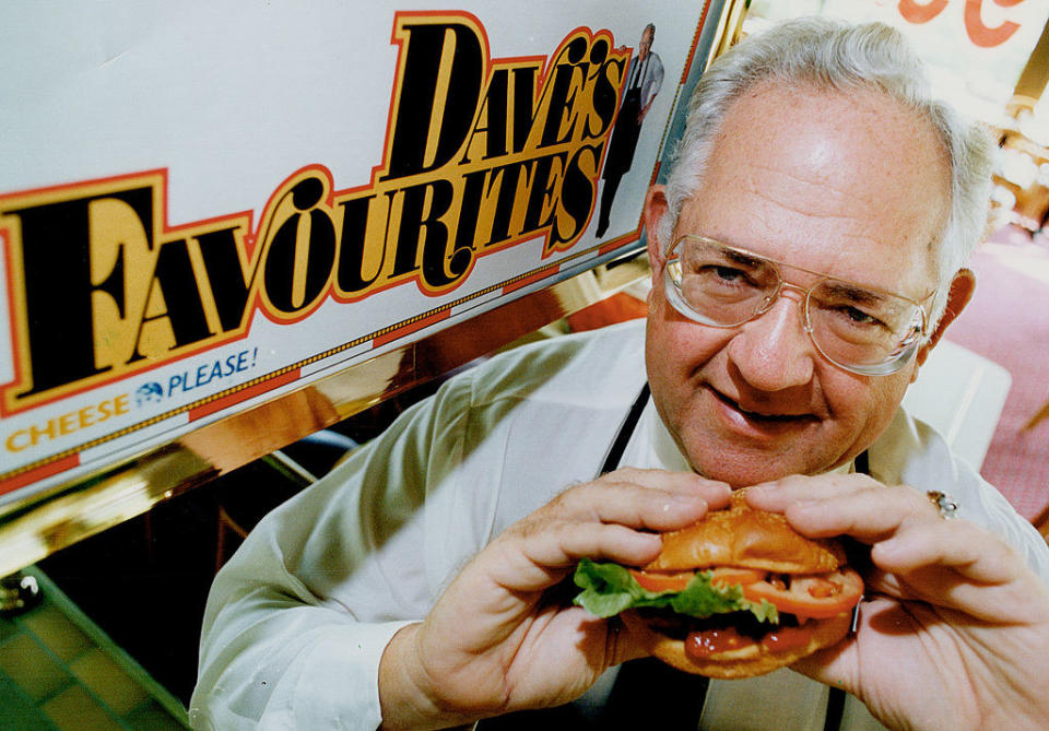 Dave holding up a burger