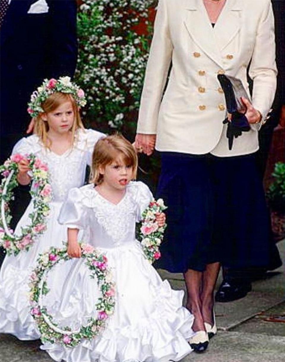 Shortly before her own nuptials, Princess Eugenie took a trip down memory lane by sharing a sweet Instagram photo with Princess Beatrice from 1993 when they <a href="https://people.com/royals/princess-eugenie-throwback-photo-princess-beatrice-ahead-royal-wedding/" rel="nofollow noopener" target="_blank" data-ylk="slk:served as bridesmaids;elm:context_link;itc:0;sec:content-canvas" class="link ">served as bridesmaids</a> to their former nanny, Alison Wardley, as she married former royal bodyguard Ben Dady.