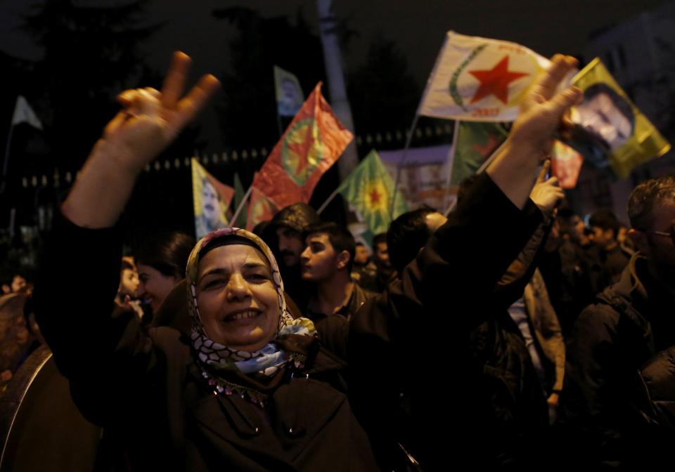 Pro-Kurdish demonstrators celebrate in central Istanbul, after Kurdish forces took full control of the Syrian town of Kobani