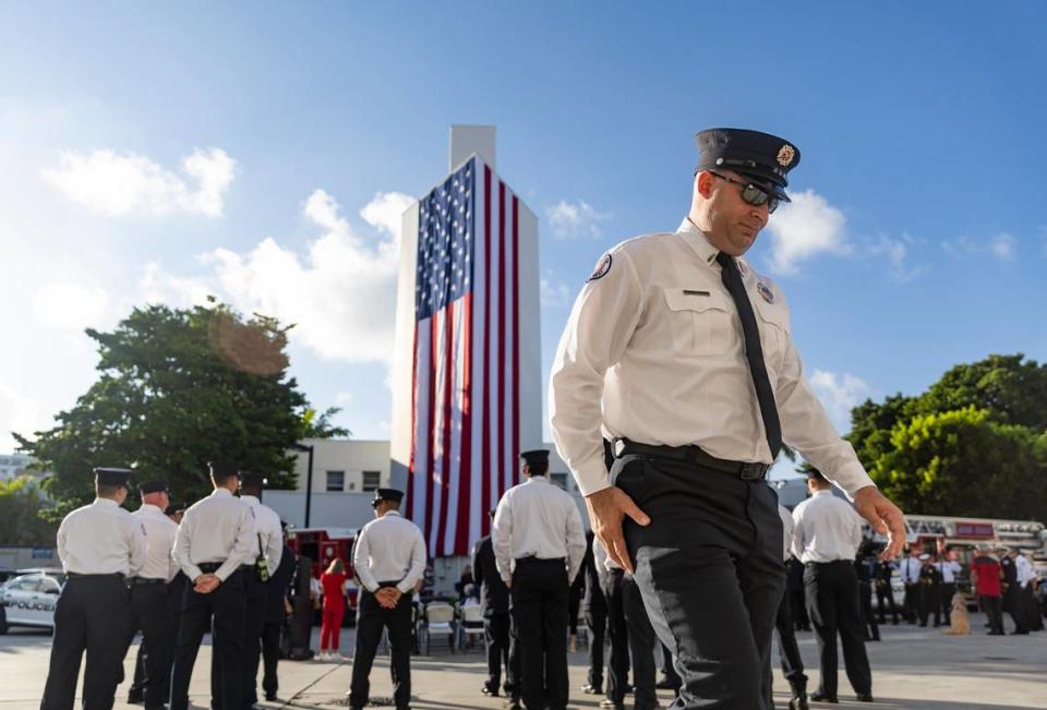 Miami Beach Firefighter Michael Saavedra, far-right, attends a September 11, 2001, remembrance ceremony at Fire Station 2 on Monday, Sept. 11, 2023, in Miami Beach, Fla.