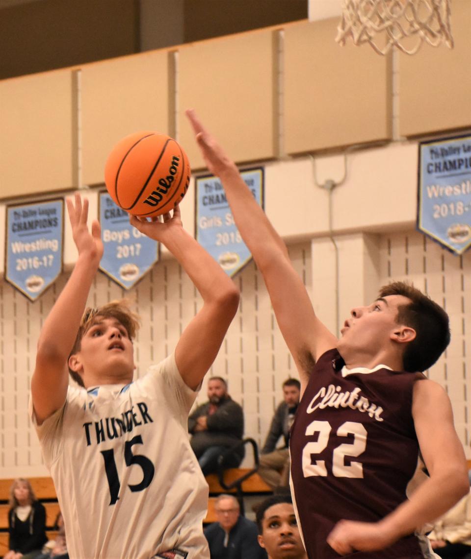 Central Valley Academy junior Deacon Judd (15) shoots over Clinton Warrior Jack Palmieri Dec. 6. Judd and the Thunder enter the Section III playoffs as the only unbeaten team and the No. 1 seed among the Class B boys.