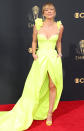 <p>pops on the carpet in her highlighter yellow Vera Wang gown featuring a center split, ruched bodice and floral appliqués at the sleeves, paired with matching sandals and De Beers jewels.</p>