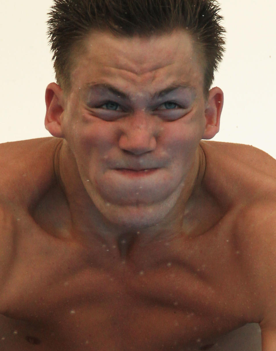 "Ah man, I left my phone in my pocket." Espen Valhein of Norway competes in the Men's 3m Springboard preliminary round during Day Six of the 14th FINA World Championships at the Oriental Sports Center on July 21, 2011 in Shanghai, China. (Photo by Ezra Shaw/Getty Images)