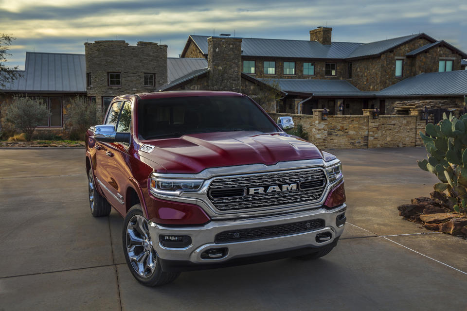 A red 2019 Ram 1500 Limited, an upscale full-size pickup truck.