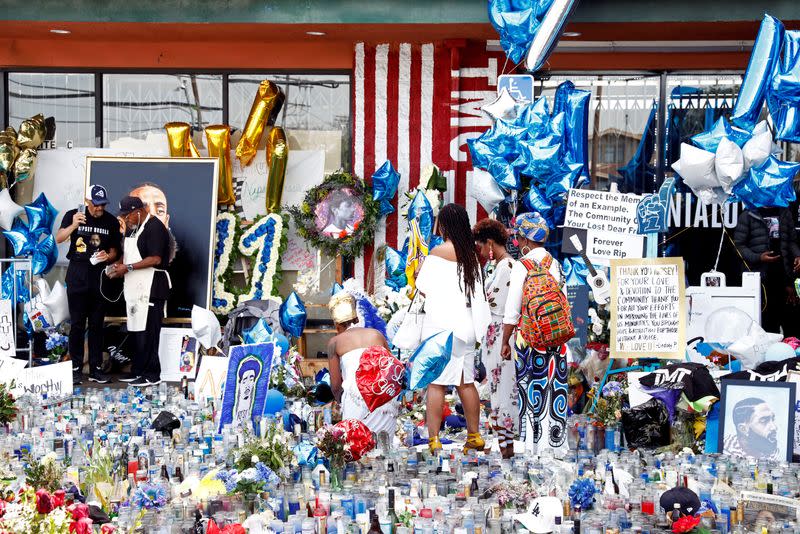 FILE PHOTO: People mourn the shooting death of musician Nipsey Hussle outside of The Marathon Clothing store on Slauson Avenue in Los Angeles