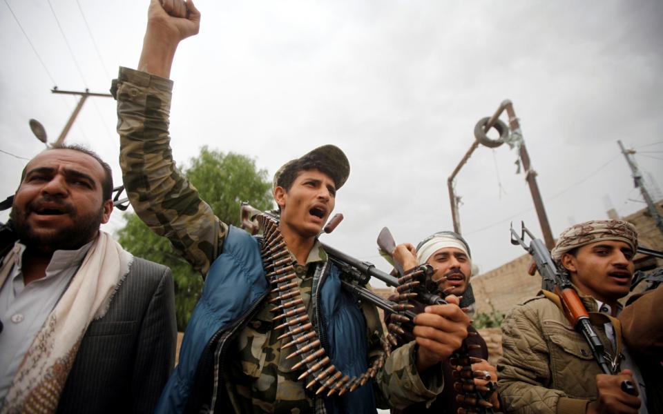 Armed followers of the Houthi movement protest against the president's announcement of an extension of the state of emergency, what they say is a US interference in Yemen's affairs in Sanaa - Credit: Reuters