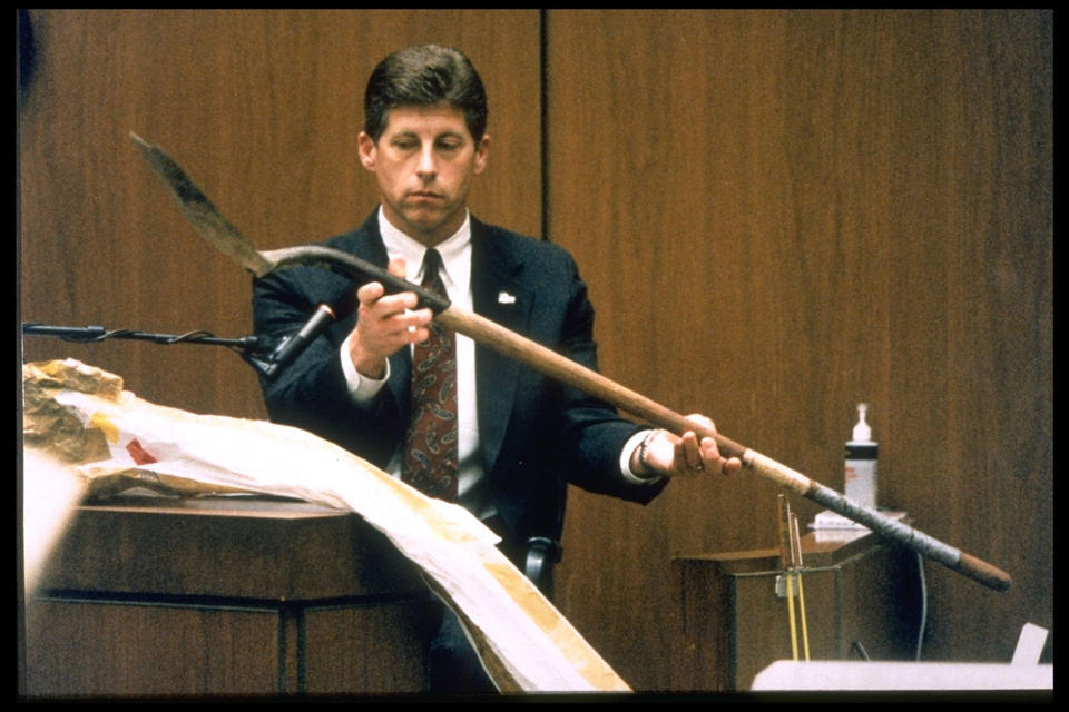 <p>Los Angeles Police detective Mark Fuhrman holds up the shovel found in O.J. Simpson’s Ford Bronco during the investigation into the murders of Ron Goldman and Nicole Brown Simpson while testifying for the prosecution in Los Angeles,10 March 10, 1995. (Photo: Ted Soqui/Sygma via Getty Images) </p>