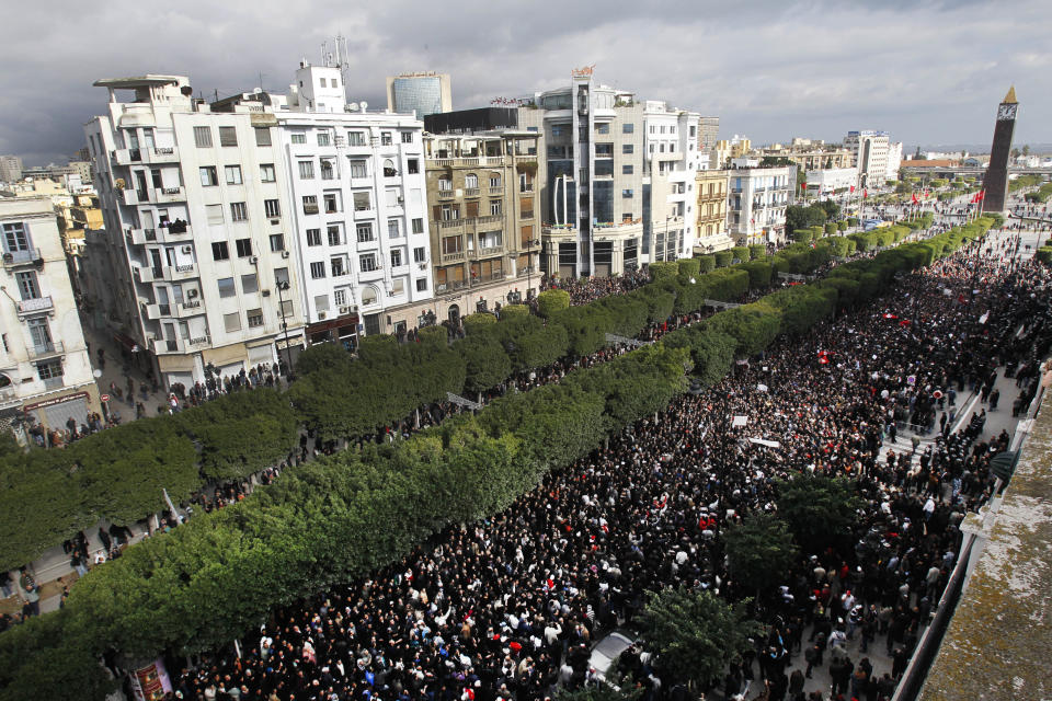 FILE - In this Friday, Jan. 14, 2011 file photo, protesters chant slogans against President Zine El Abidine Ben Ali during a demonstration in Tunis. Since winning a parliamentary seat in 2019, Tunisian lawmaker Abir Moussi has become one of the country’s most popular, and most controversial, politicians, riding a wave of nostalgia for a more stable and prosperous time, just as Tunisia marks 10 years since protesters overthrew autocratic former President Zine El Abidine Ben Ali. Since 2011, Tunisia has been plagued by sinking wages, growing joblessness and worsening public services. Unemployment has risen amid the coronavirus pandemic from 15% to 18%. Attempts to migrate to Europe by sea have soared. (AP Photo/Christophe Ena, File)