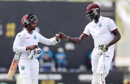 Cricket - West Indies v England - First Test - Sir Vivian Richards Stadium, Antigua - 17/4/15 West Indies' Denesh Ramdin and Jason Holder walk off unbeaten at tea Action Images via Reuters / Jason O'Brien Livepic