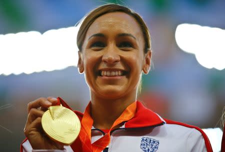 Jessica Ennis-Hill of Britain presents her gold medal after winning the women's heptathlon during the 15th IAAF World Championships at the National Stadium in Beijing, China August 24, 2015. REUTERS/Damir Sagolj