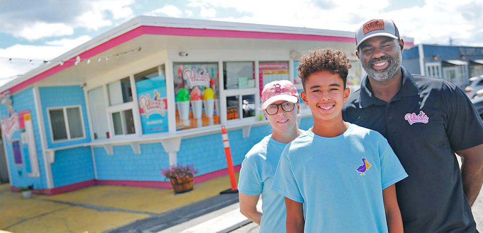 The Jean Louis family owns Pelican's Snoballs in Marshfield, from left,  Michelle, son Leon, and Gino Jean Louis.