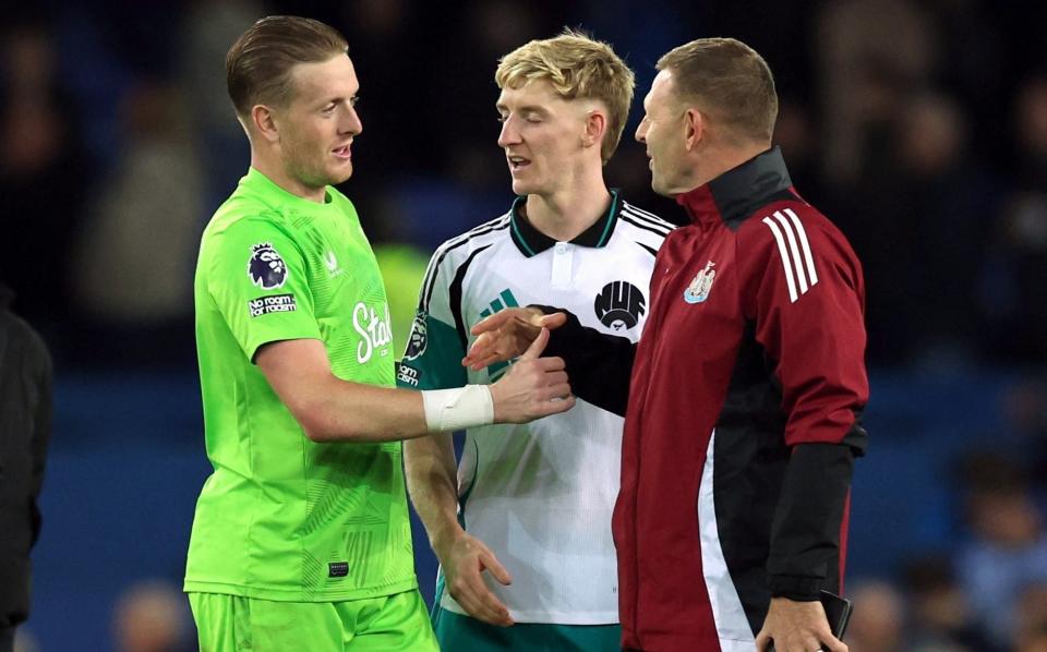 Jordan Pickford of Everton and Anthony Gordon of Newcastle United exchange words after the teams' goalless Premier League draw.