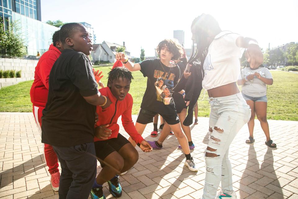 People dance while listening to music during the "Downtown at Sundown" event hosted by the Johnson County Iowa Juneteenth Commemoration, Friday, June 17, 2022, at Chauncey Swan Park in Iowa City, Iowa.