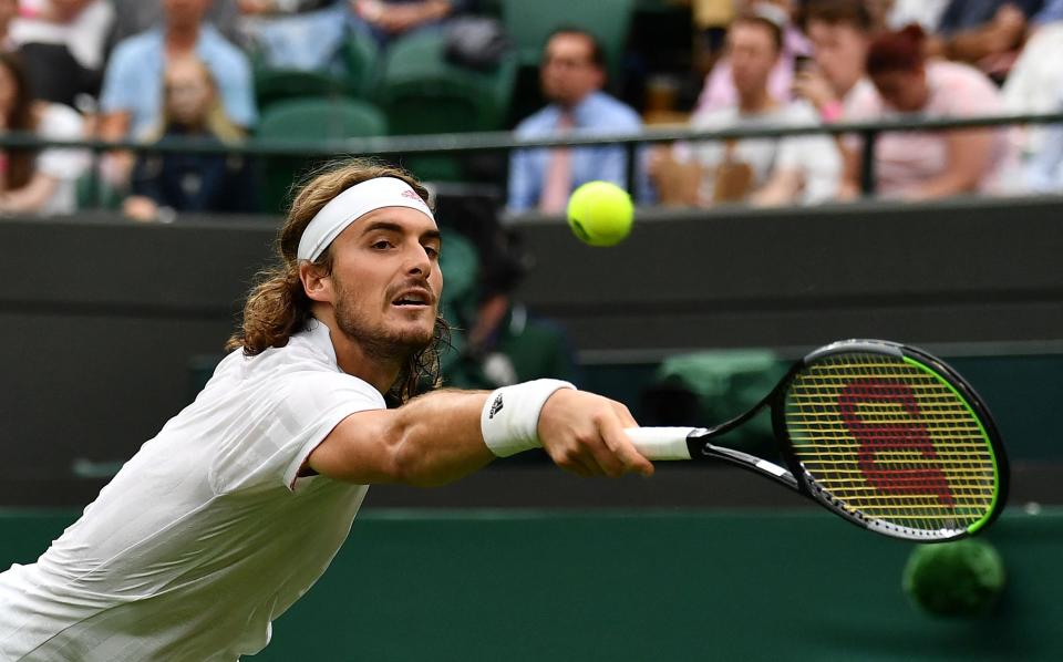 Stefanos Tstistipas crashed out in the first round at Wimbledon again (AFP via Getty Images)