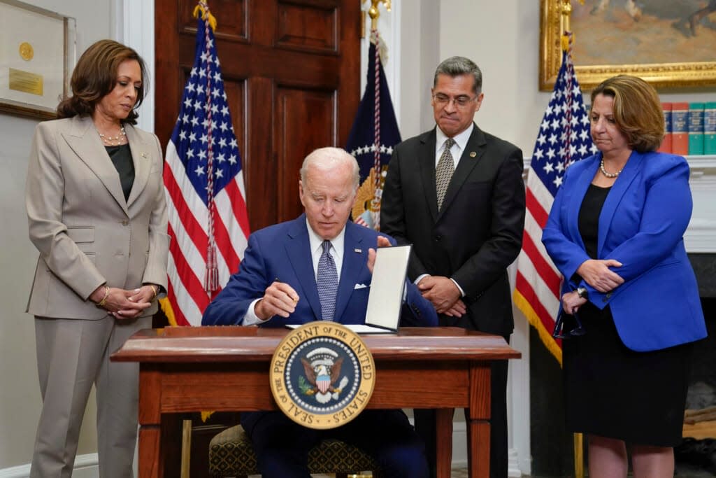 President Joe Biden signs an executive order on abortion access during an event in the Roosevelt Room of the White House, Friday, July 8, 2022, in Washington. (AP Photo/Evan Vucci)