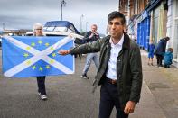 FILE PHOTO: Nationalist demonstrators welcome Britain's Chancellor of the Exchequer Rishi Sunak in Rothesay