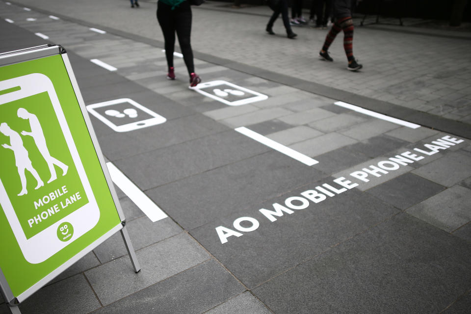 Manchester is trialling Europe's first designated mobile phone slow lanes for pedestrians (PA)