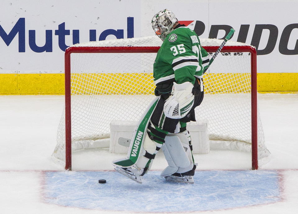 Dallas Stars goalie Anton Khudobin (35) kicks the puck after being scored against by Vegas Golden Knights defenseman Alec Martinez during second-period NHL Western Conference final playoff game action in Edmonton, Alberta, Saturday, Sept. 12, 2020. (Jason Franson/The Canadian Press via AP)