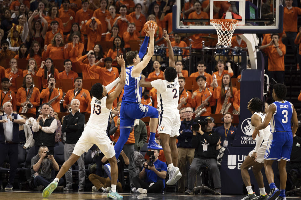 Duke's Kyle Filipowski (30) goes up for a basket against Virginia during the second half of an NCAA college basketball game in Charlottesville, Va., Saturday, Feb. 11, 2023. (AP Photo/Mike Kropf)