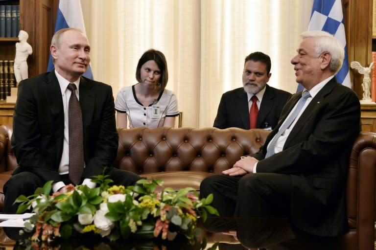 Greek President Prokopis Pavlopoulos (R) meets Russian President Vladimir Putin during a meeting at the Presidential Palace on May 27, 2016, in Athens