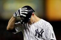 Oct 6, 2015; Bronx, NY, USA; New York Yankees center fielder Brett Gardner (11) reacts after grounding out against the Houston Astros during the eighth inning in the American League Wild Card playoff baseball game at Yankee Stadium. Adam Hunger-USA TODAY Sports