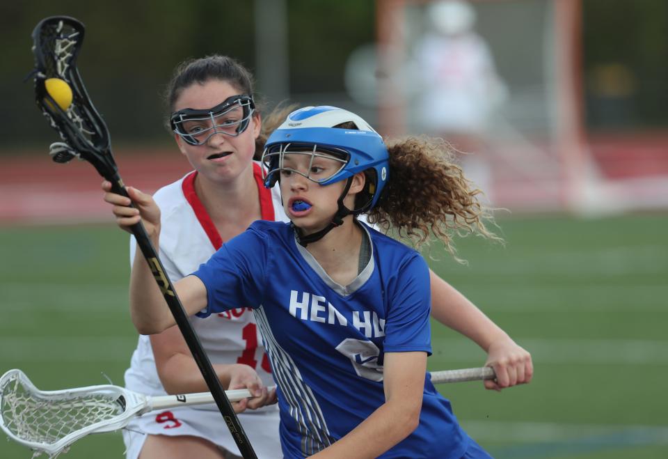 Hen Hud's Carleigh Ortiz (6) breaks away from Somers' Jocelyn Klein (13) during girls lacrosse action at Somers High School May 11, 2023. Somers won the game 12-7.
