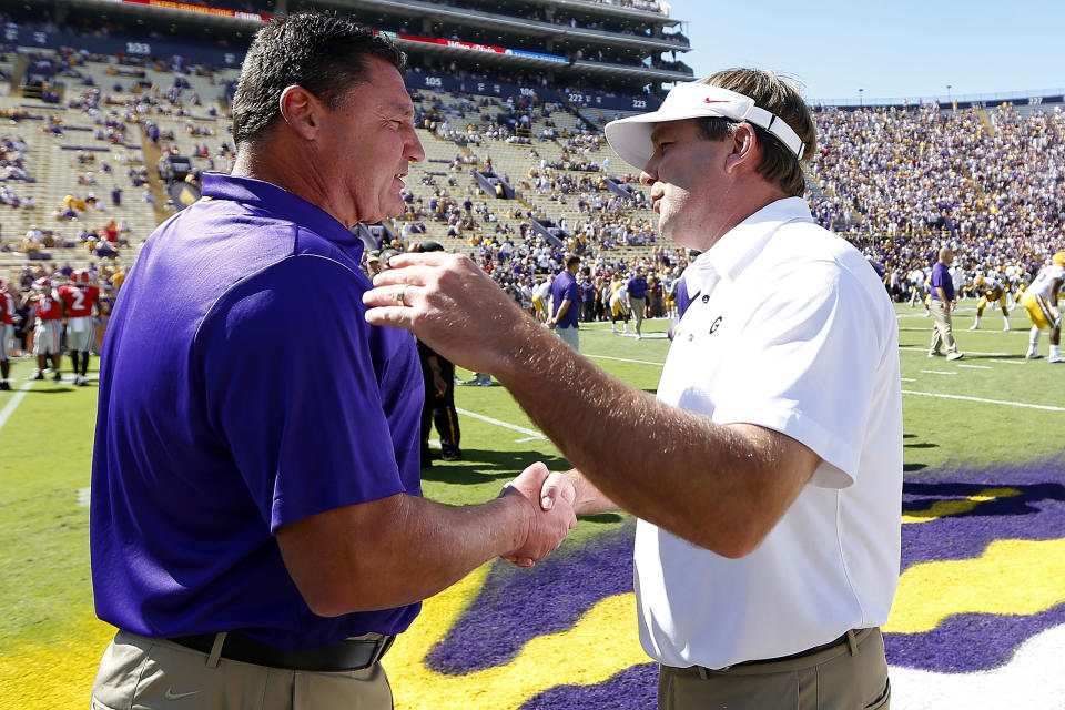 BATON ROUGE, LA - OCTOBER 13:  Head coach Ed Orgeron (L) of the LSU Tigers and head coach Kirby Smart of the Georgia Bulldogs meet on the field before a game at Tiger Stadium on October 13, 2018 in Baton Rouge, Louisiana.  (Photo by Jonathan Bachman/Getty Images)