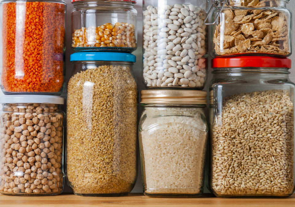 Dry beans and rice stored in jars in a pantry