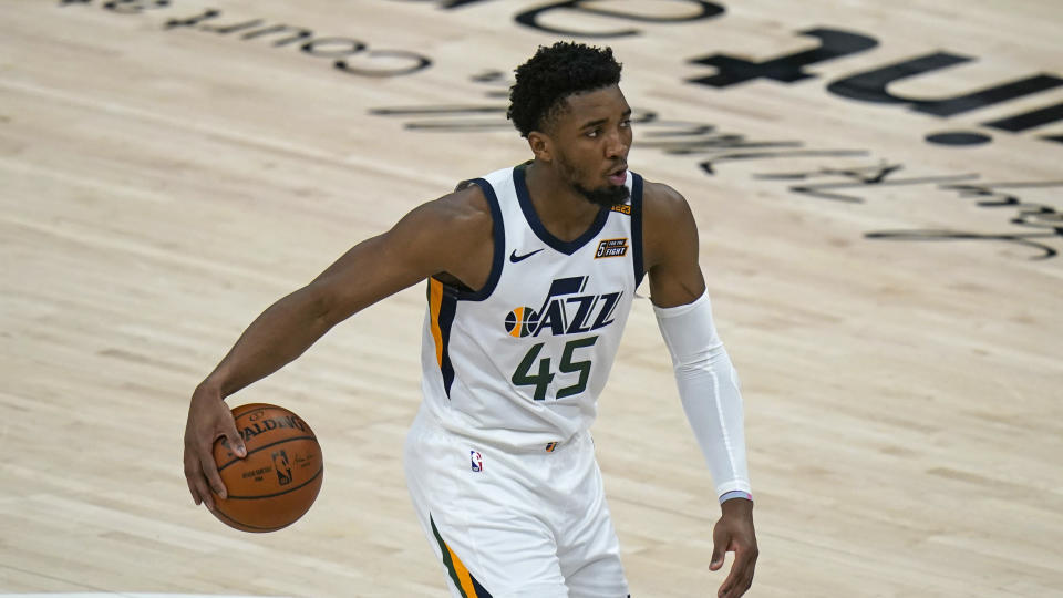 Utah Jazz guard Donovan Mitchell (45) brings the ball up court against the Indiana Pacers in the first half during an NBA basketball game Friday, April 16, 2021, in Salt Lake City. (AP Photo/Rick Bowmer)